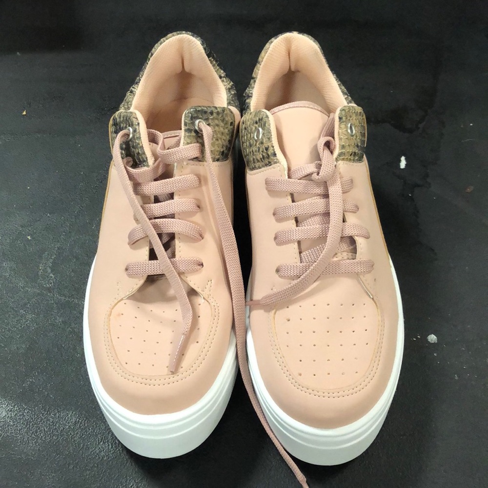 pink sneakers with snakeskin detail
